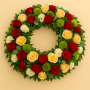 Fleurs deuil, deces et enterrement Nancy par fleuriste Interflora : Sentiment, couronne de roses rouges et saumonées.