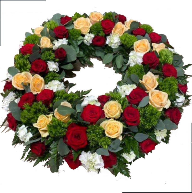Fleurs deuil, deces et enterrement Nancy par fleuriste Interflora : Sentiment, couronne de roses rouges et saumonées.